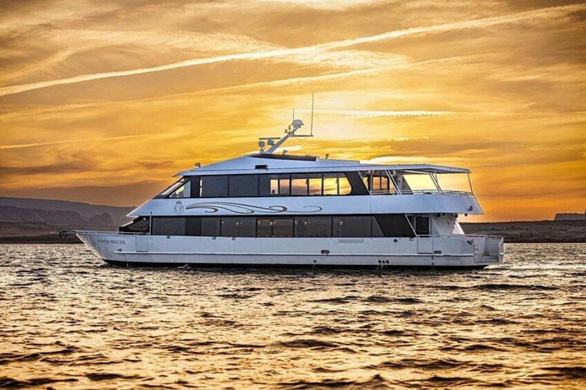 A white yacht on calm waters during sunset. 2