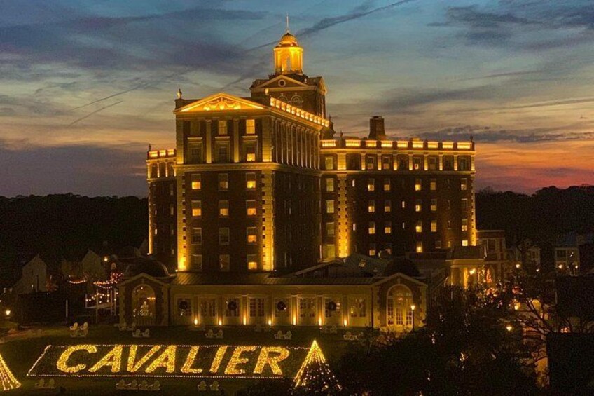 A large, illuminated building with a prominent dome and the word 'CAVALIER' displayed on the ground. 3