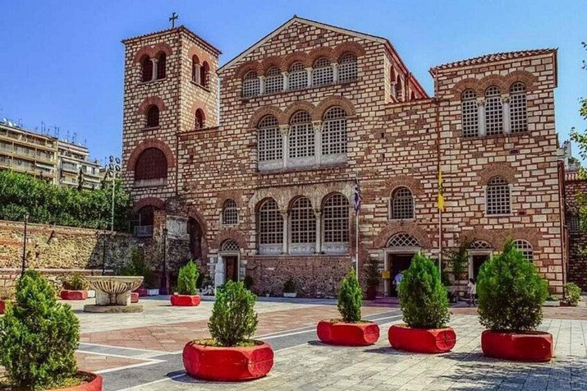 A historic building with arched windows and a bell tower. 4