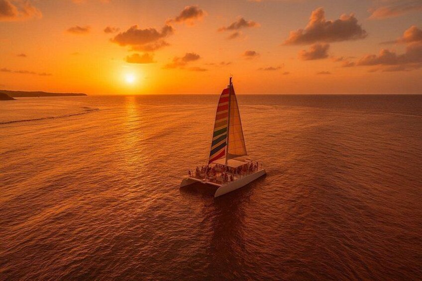 A sailboat on calm waters during sunset. 2