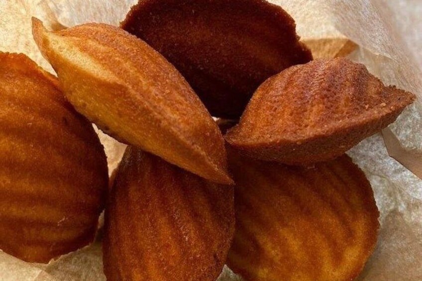 A close-up of a food item, possibly a pastry, with a textured surface and a golden-brown color. 5