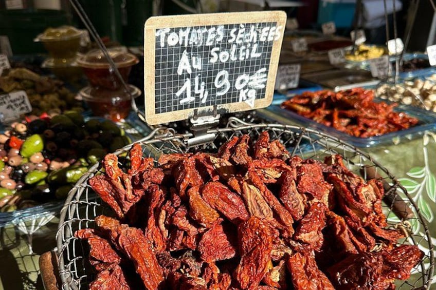 A market stall with dried tomatoes on sale. 2