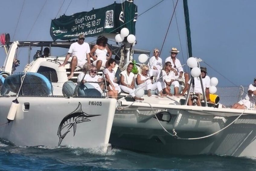 A group of people on a boat with a QR code and a website address. 2