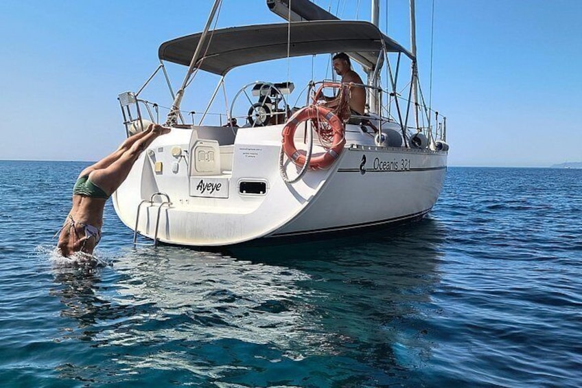 A sailboat named 'Ayeve' on calm waters. 2
