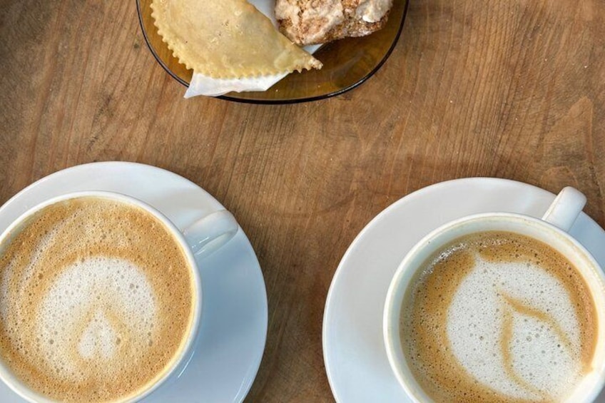 Two cups of coffee on saucers on a wooden table. 4
