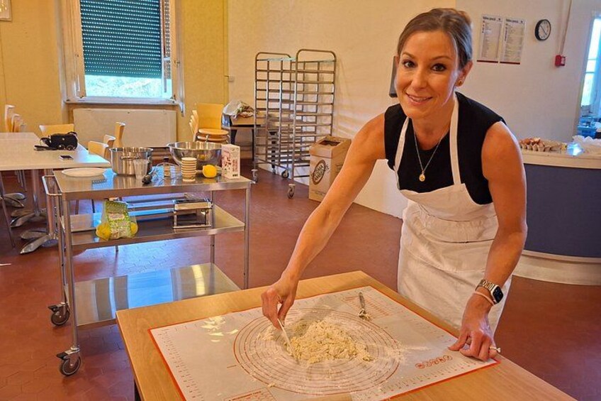 A person in a kitchen setting, preparing food on a cutting board. 3
