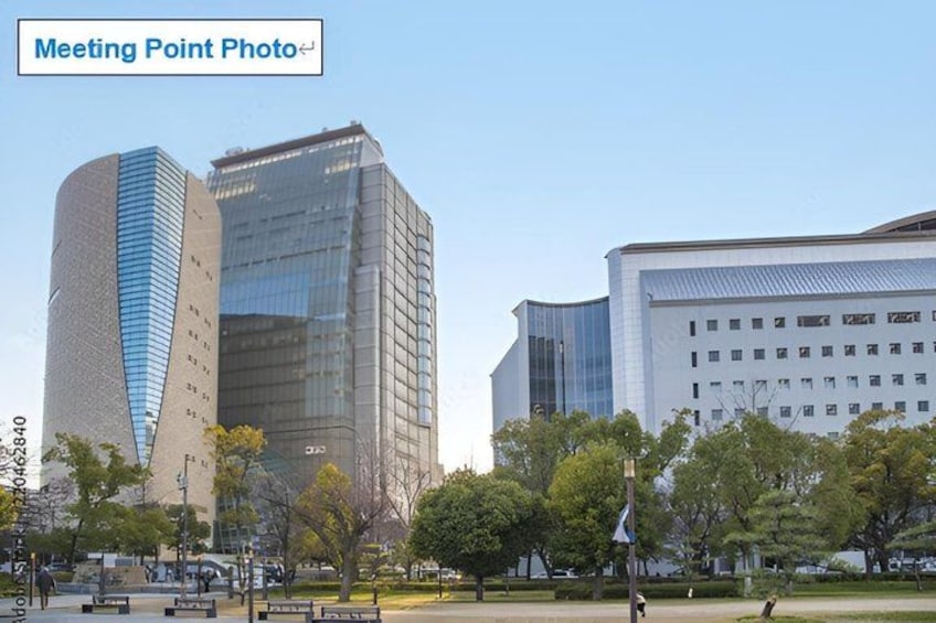 A cityscape with modern buildings, a park with trees, and a clear sky. 3