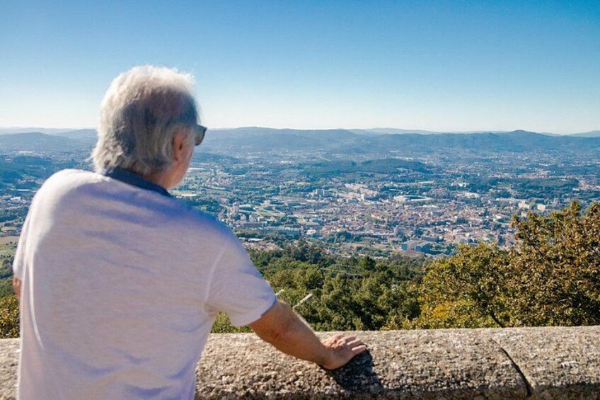 A person overlooking a cityscape from a high vantage point. 3