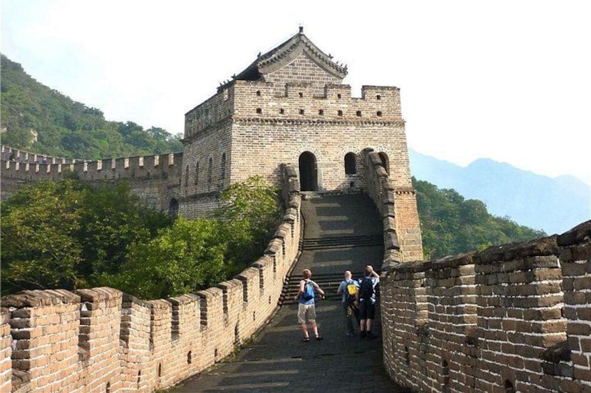 The Great Wall of China with tourists walking along it. 1