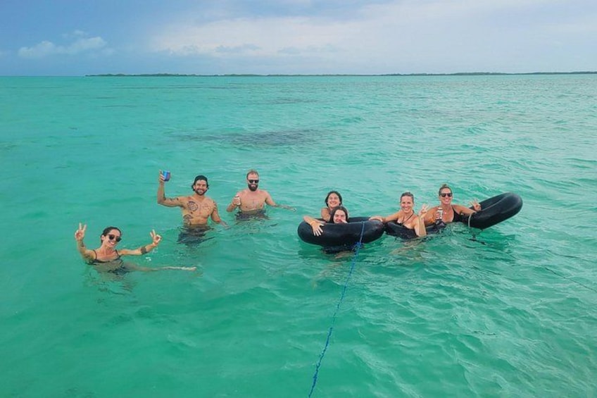 People floating on the water with tubes. 1