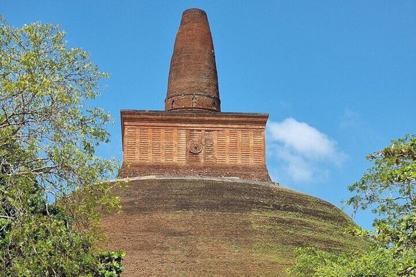 A large brick structure with a tall, narrow tower. 1