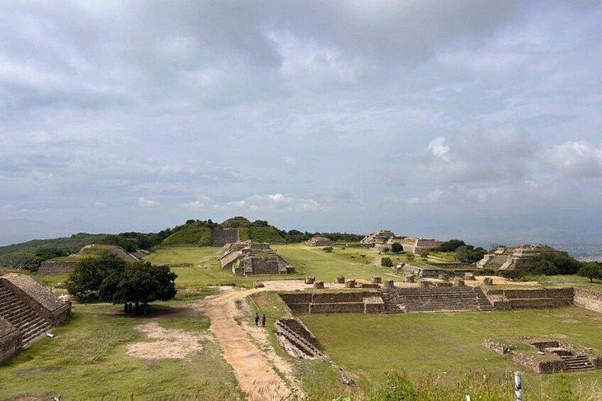 Ancient ruins with multiple structures and a clear sky. 5