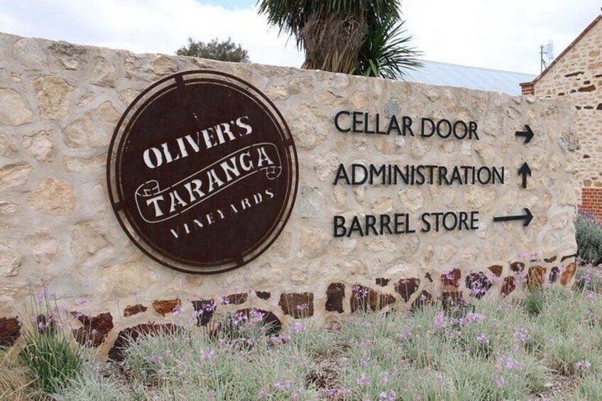 A sign for Oliver's Taranga Vineyards with directions to the cellar door, administration, and barrel store. 5