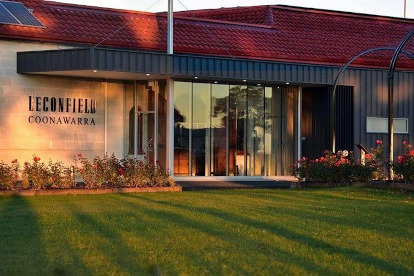 A modern building with a red roof, large glass windows, and a sign that reads 'LECONFIELD COONAWARRA.' 4