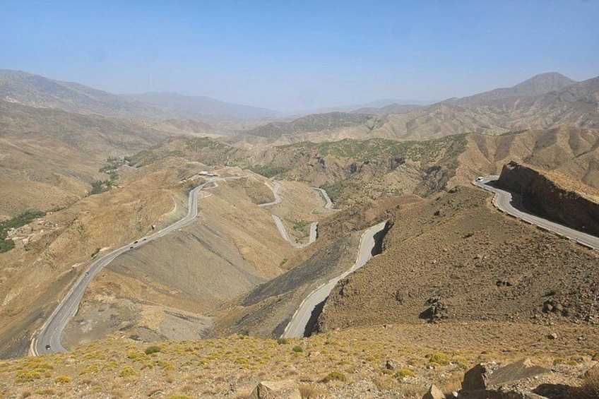 A winding mountain road with a clear sky. 4