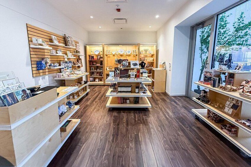 A bookstore with wooden shelves and a large window. 2