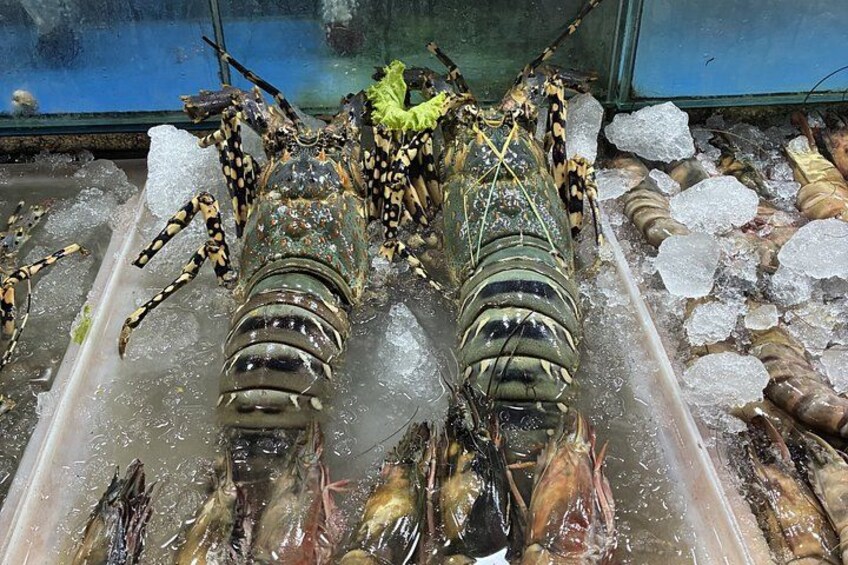 Lobsters on ice in a display case. 4
