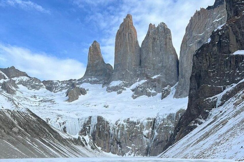 A snow-covered mountain landscape with sharp peaks and rugged terrain. 5