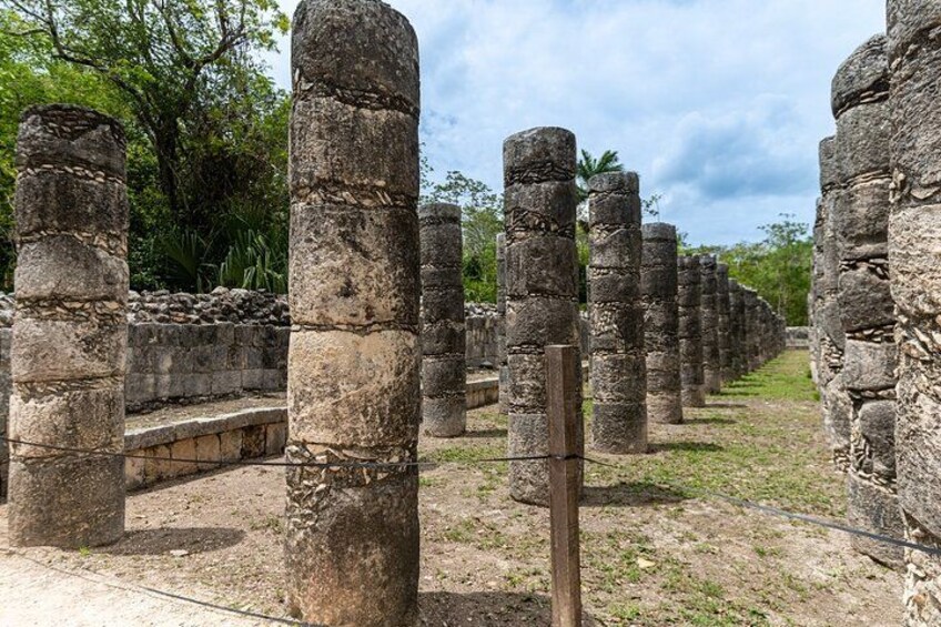 Ancient stone pillars in a historical site. 4