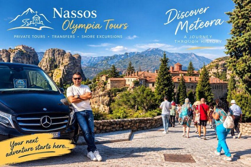 A tour bus parked with a guide and tourists in a mountainous area with historical buildings. 5
