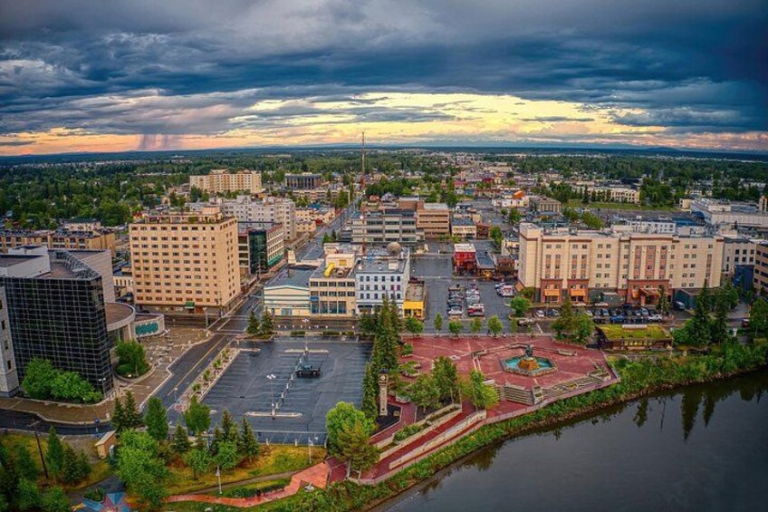 Aerial view of downtown Fairbanks, Alaska, showcasing the Chena River and cityscape. 1