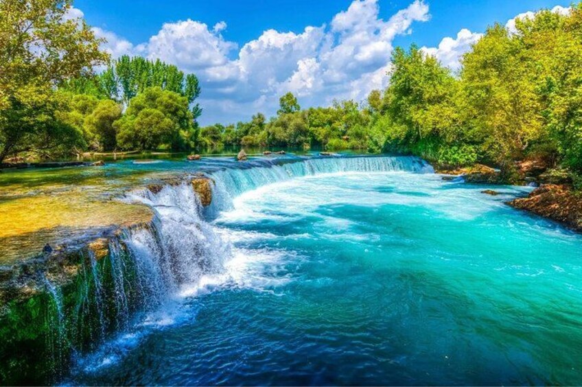 Natural waterfall stop in a green setting 2