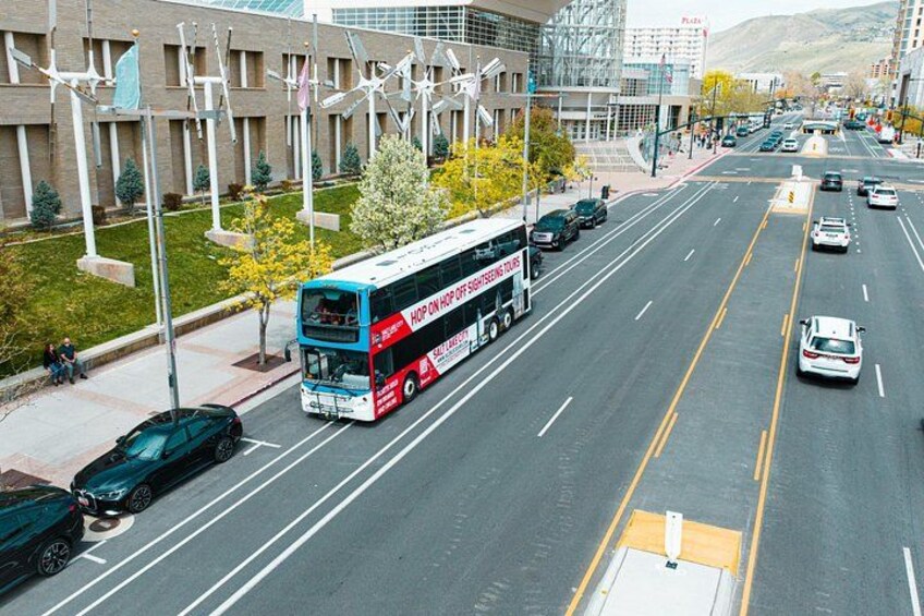 A multi-lane road with a double-decker bus, cars, and a pedestrian crossing. 3