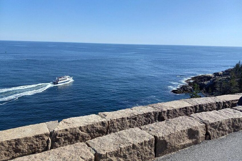 Sightseeing boat cruising out on the Gulf of Main beside Otter Point. Park Loop Road, Acadia National Park. 3