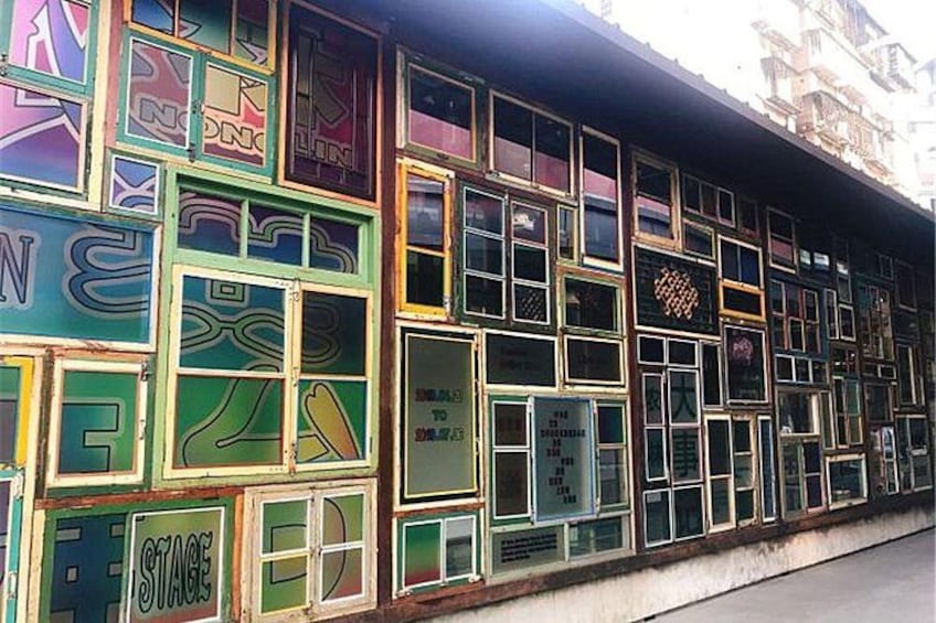 A building facade with colorful, patterned windows. 5