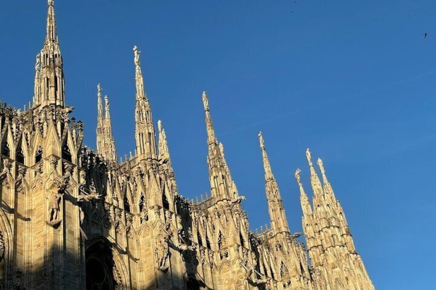 A Gothic cathedral with multiple spires and intricate stone carvings. 4