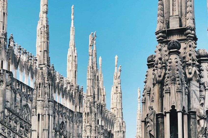 A Gothic cathedral with intricate spires and statues. 3