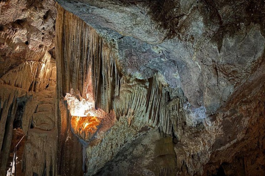 A cave with stalactites and stalagmites. 2