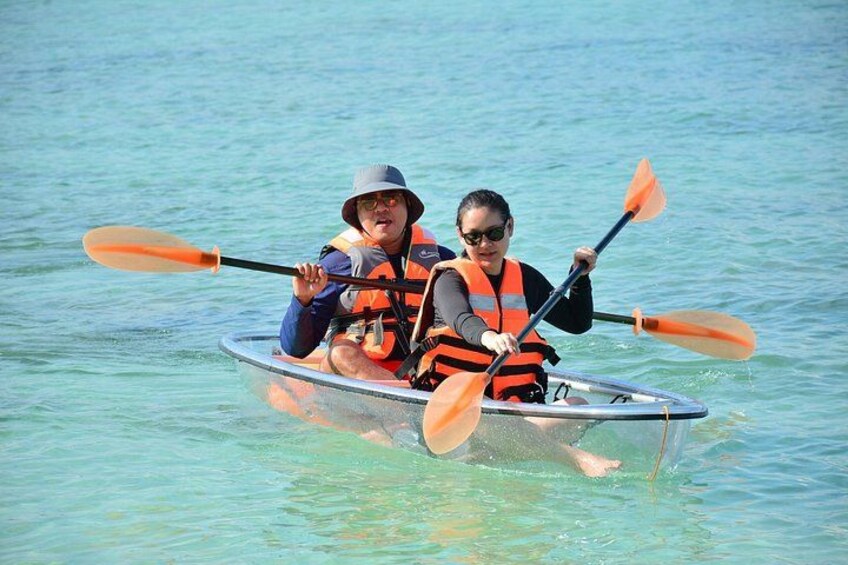 Two people kayaking on a calm body of water. 5