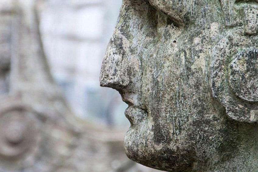 A weathered stone sculpture with intricate carvings. 2