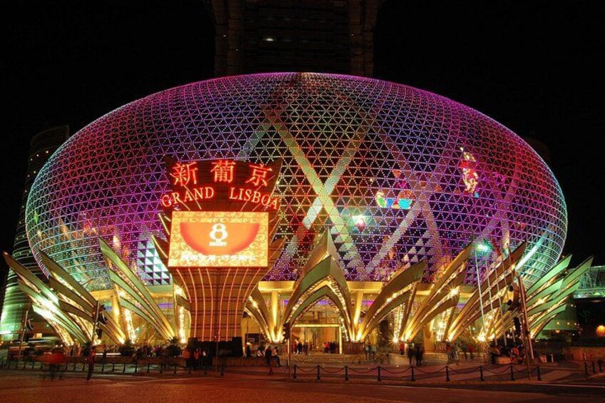 A large, illuminated dome structure with a sign reading 'Grand Lisboa.' 4