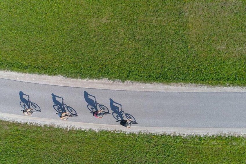 A road with a cyclist and a motorcyclist. 2