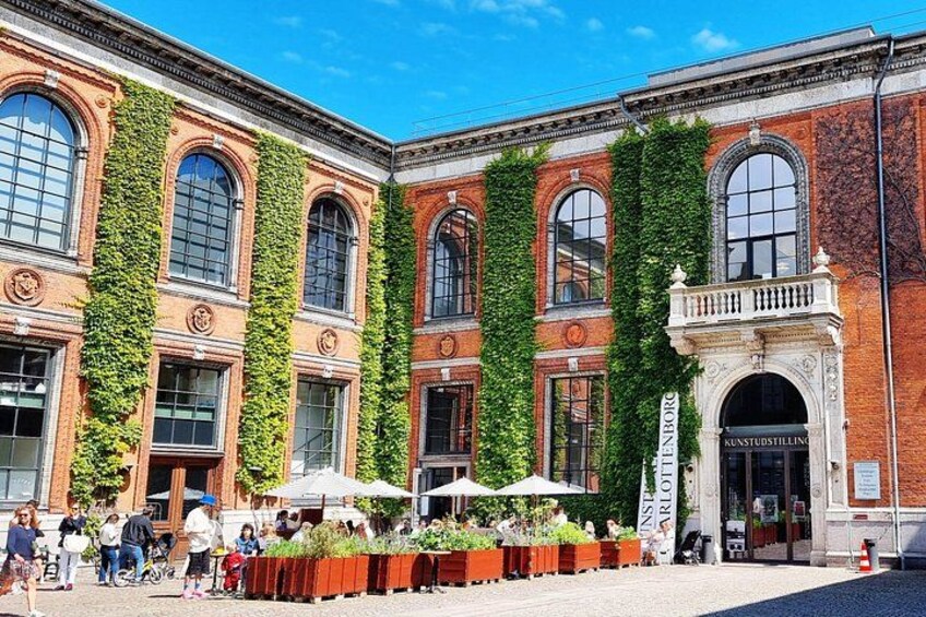 A historic building with arched windows and ivy-covered walls. 4