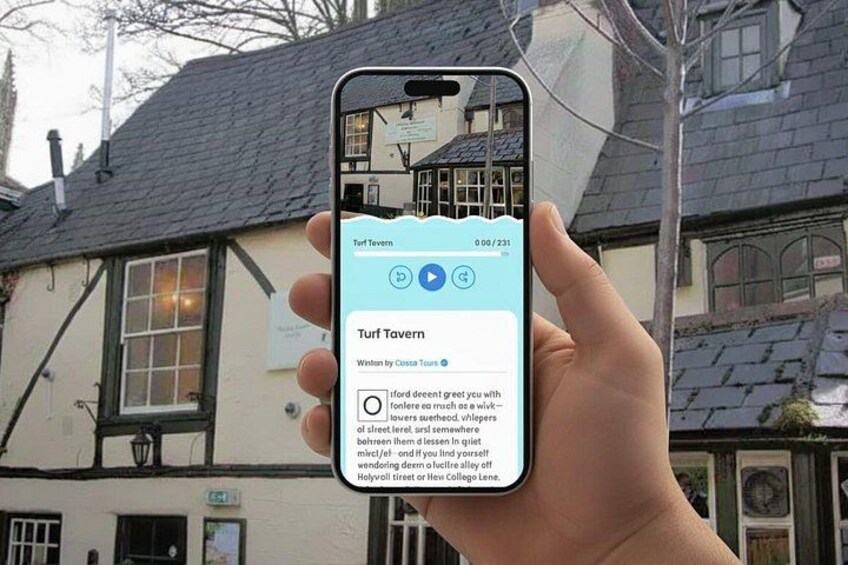 A hand holding a smartphone displaying a map of Turf Tavern. 1