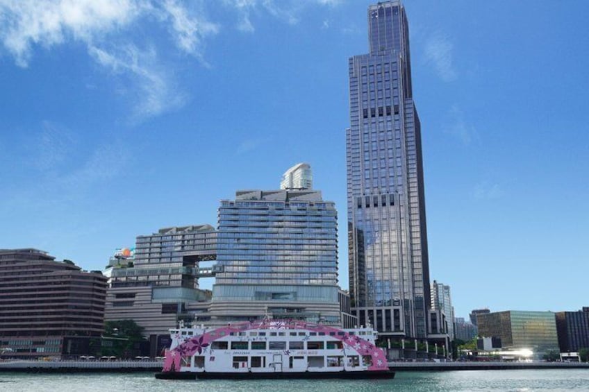 A city skyline with modern skyscrapers and a river with a boat. 2