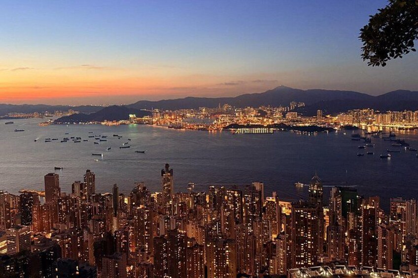 A cityscape with high-rise buildings and a harbor filled with boats. 5