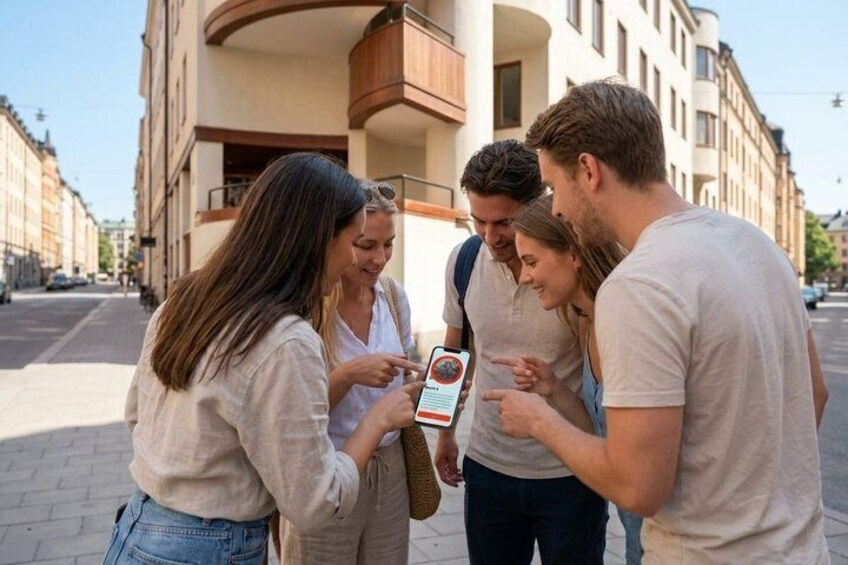 A group of people looking at a map on a sunny street. 5