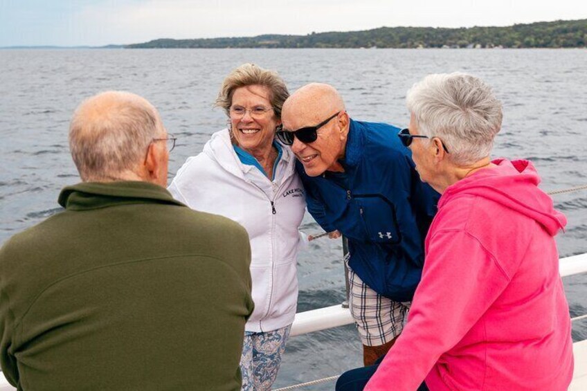 A group of people on a boat near a body of water. 5