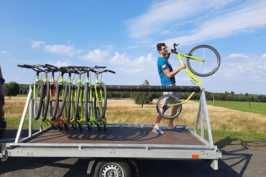 Our employee unloads scooters for clients 4