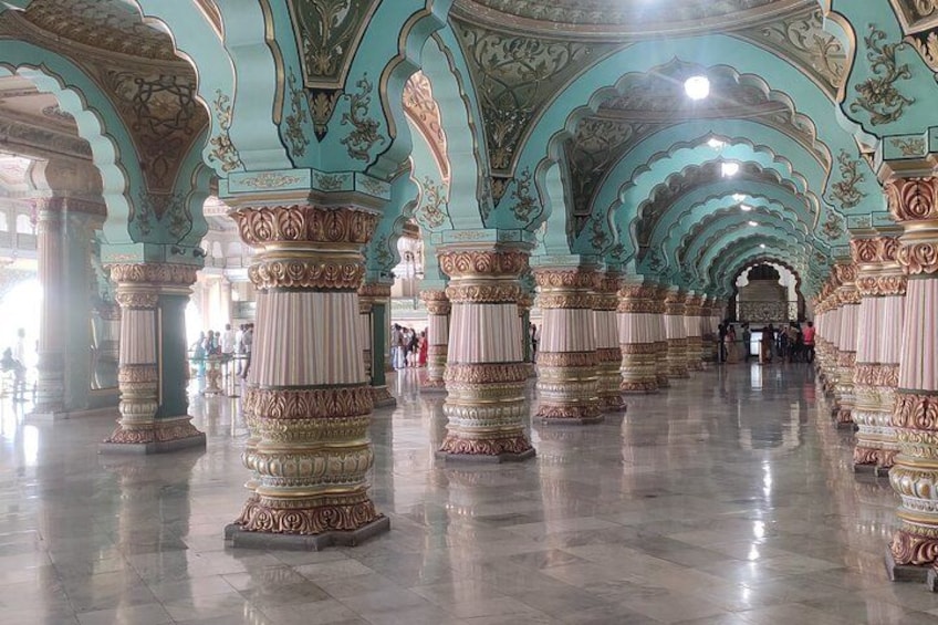 A grand hall with ornate columns and arches. 5
