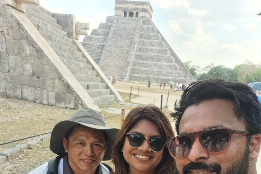 A large stone pyramid structure with a staircase leading up to it. 4