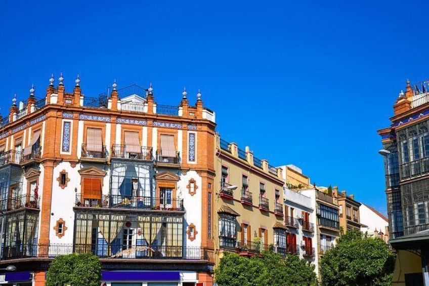 A historic building with ornate architecture and a clear blue sky. 3