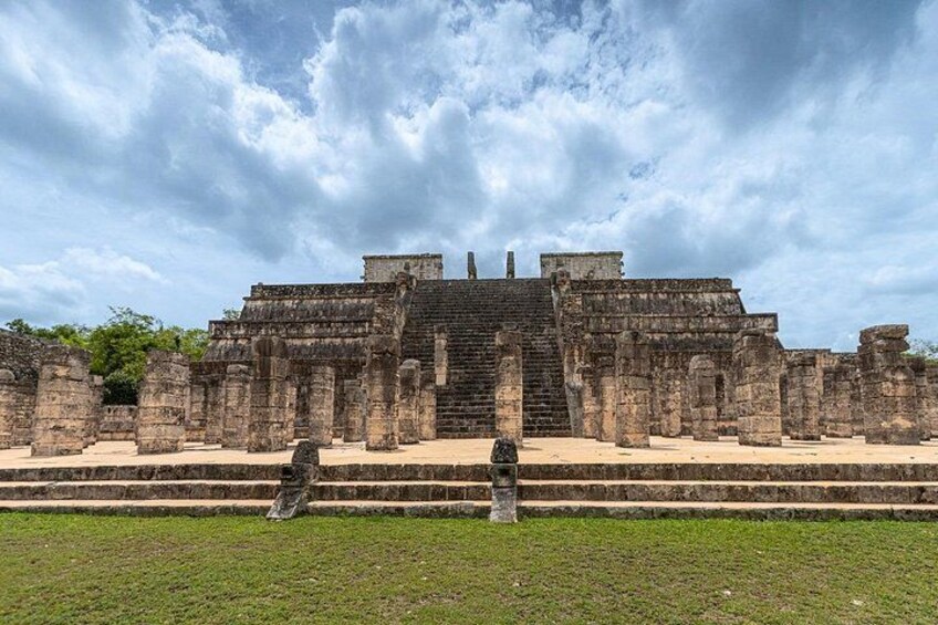 Ancient ruins with stepped pyramids and stone staircases. 2