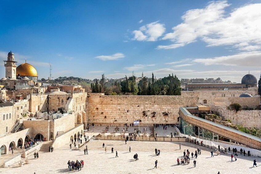 The Dome of the Rock, a large golden dome, and the Western Wall in Jerusalem. 4
