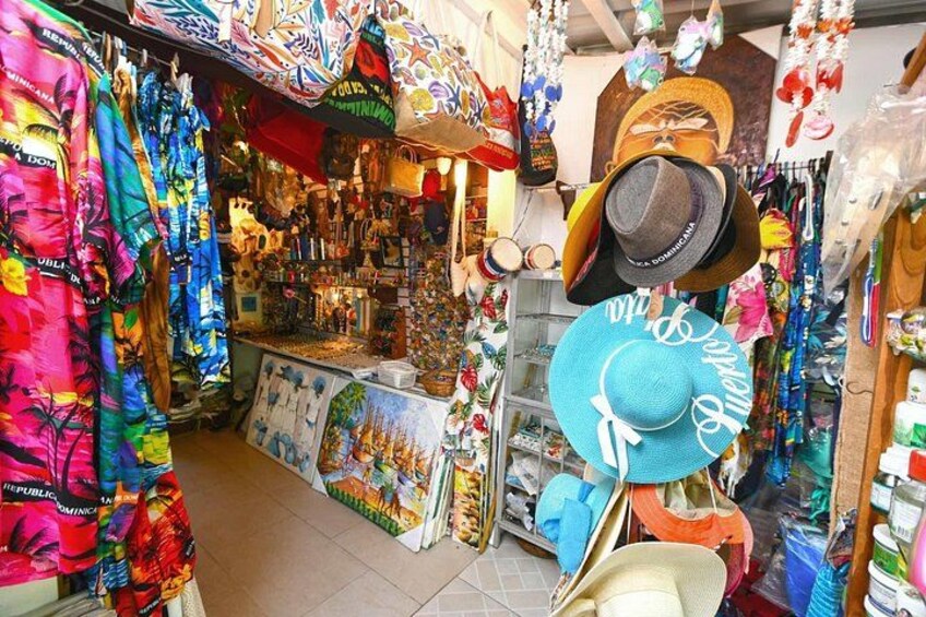 A colorful shop with various hats and clothing items on display. 4