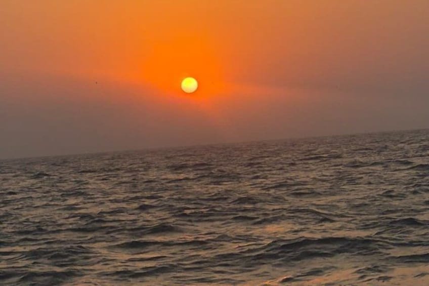 A sunset over the ocean with waves. 4